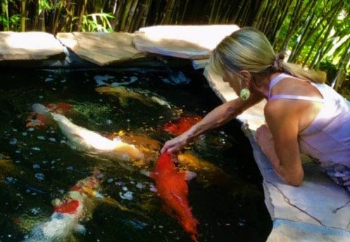 Andrea Prince feeding the koi Andrea Prince feeding the koi